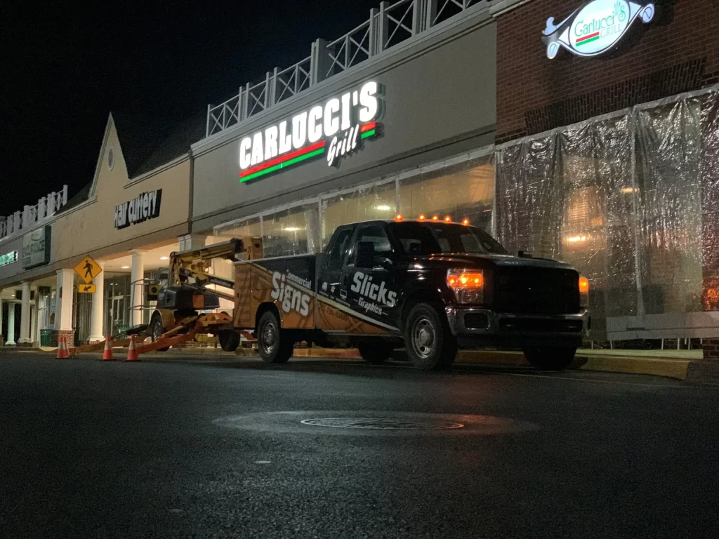 Carlucci's Channel Letter Sign and the Slicks Installation truck